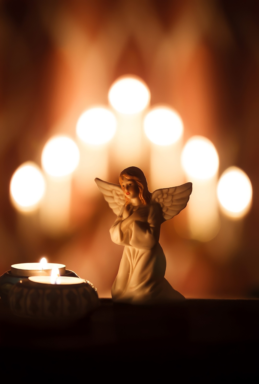 Angel Praying in Candle Background
